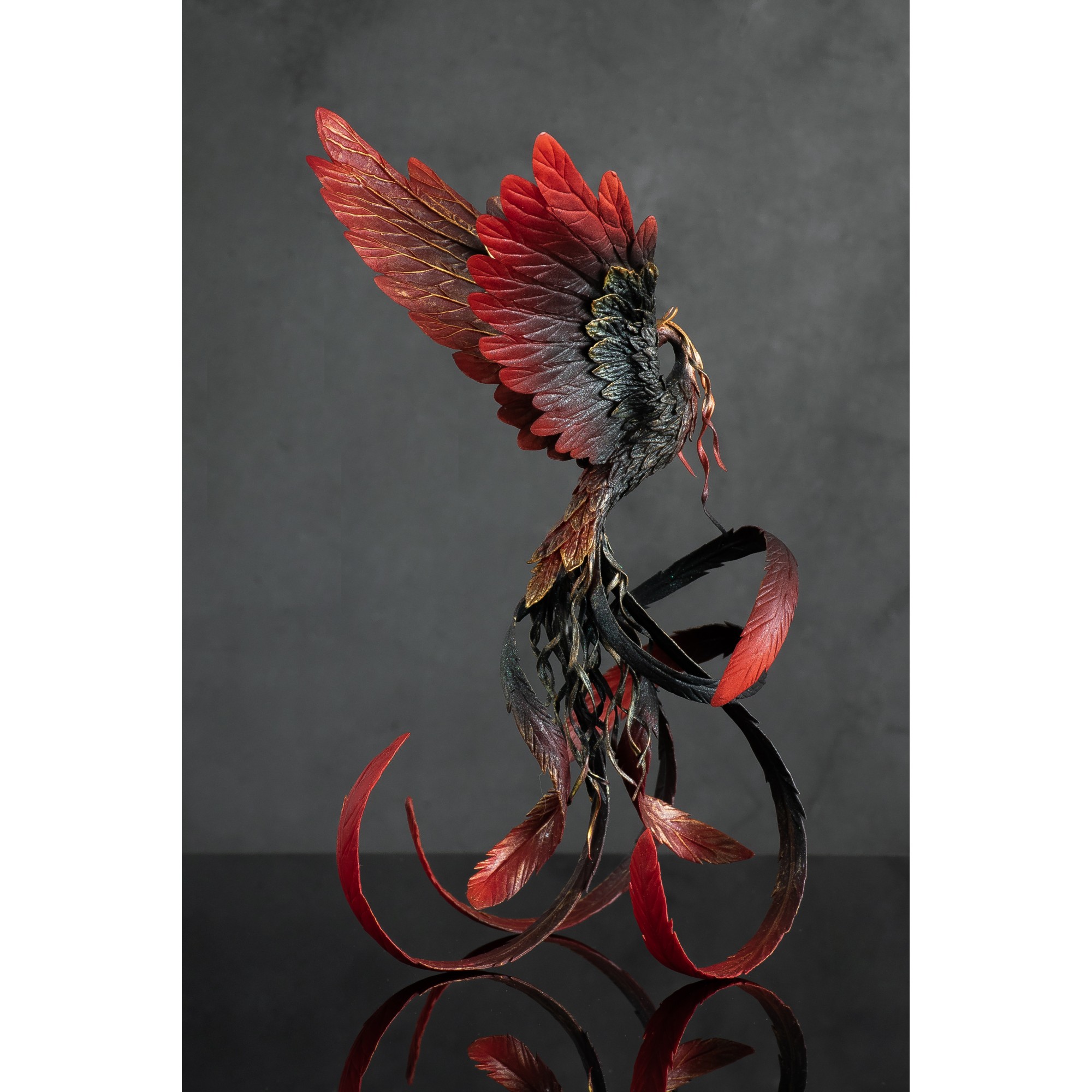 Handmade Phoenix Statue bird made of air clay. Fire bird
