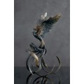 Handmade Phoenix Statue bird made of air clay. Black and white bird