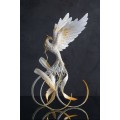 Handmade Phoenix Statue bird made of air clay. White and gold bird