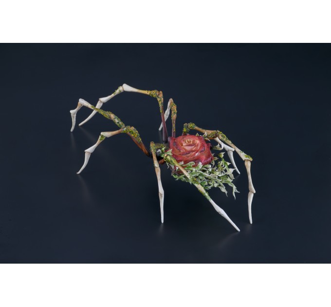 Handmade spider sculpture with a rose made of air clay