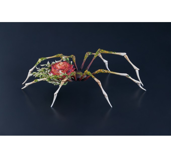 Handmade spider sculpture with a rose made of air clay