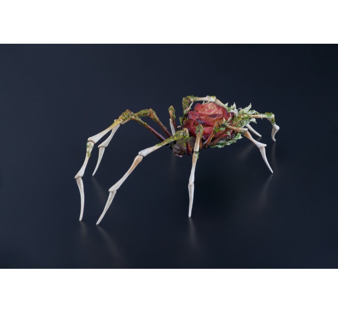 Handmade spider sculpture with a rose made of air clay