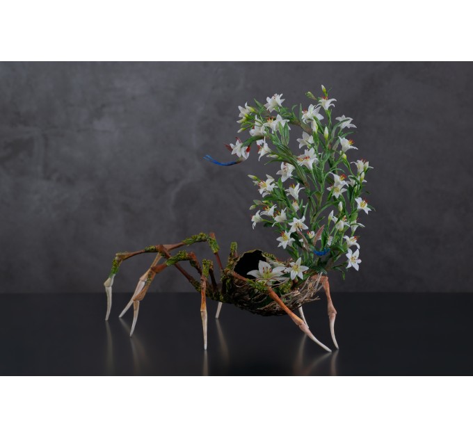 Handmade spider sculpture with lilies made of air clay