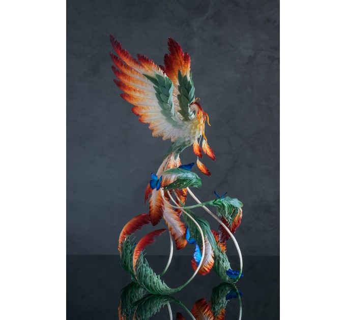 Phoenix Statue bird with blue butterfly made of air clay. Fire bird