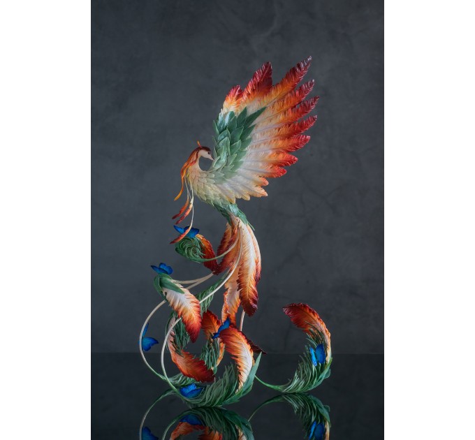 Phoenix Statue bird with blue butterfly made of air clay. Fire bird