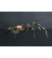 Handmade black spider sculpture with a rose made of air clay