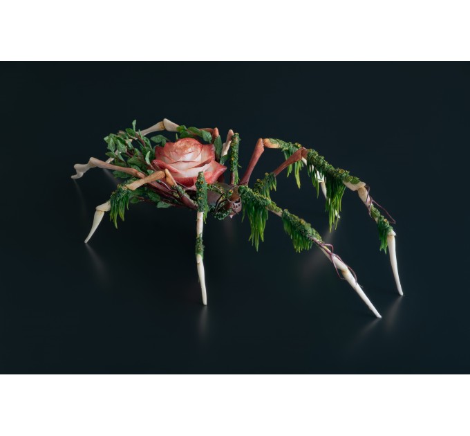 Handmade spider sculpture with a rose made of air clay.