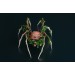 Handmade spider sculpture with a rose made of air clay.