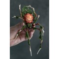 Handmade spider sculpture with a rose made of air clay.