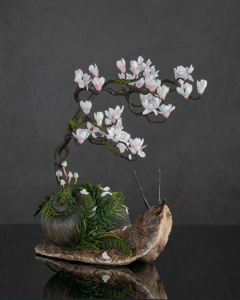 Snail with magnolia tree