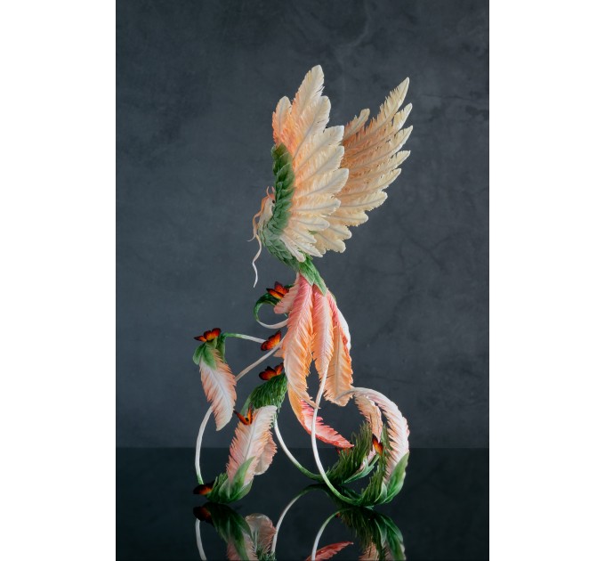 Phoenix Statue bird with fire butterfly made of air clay. Fire bird