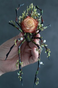 Collectible Handmade black spider sculpture with a rose 
